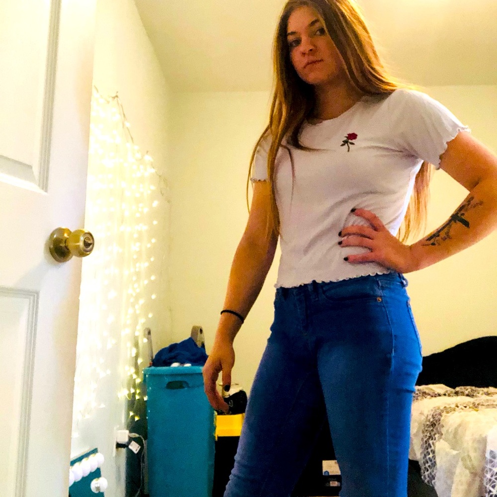 Lavender purple colored t-shirt with rose detail. No rips or stains.